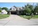 Inviting two-story home with a brick facade, open garage and well-manicured front lawn at 10949 Haig Point Dr, Fishers, IN 46037