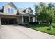 Attractive home showcasing a brick and siding exterior, a well-kept lawn and mature trees at 10949 Haig Point Dr, Fishers, IN 46037