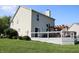 Rear exterior view showing a wooden deck, pergola and well-maintained lawn at 10949 Haig Point Dr, Fishers, IN 46037