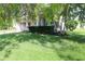 Front yard featuring a mature tree, well-maintained lawn and brick accents at 10949 Haig Point Dr, Fishers, IN 46037