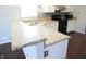 Kitchen with granite countertops, white cabinets, and stainless steel appliances at 10949 Haig Point Dr, Fishers, IN 46037