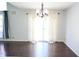 Spacious living room with hardwood floors, a large window, and neutral paint colors at 10949 Haig Point Dr, Fishers, IN 46037