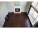 Living room featuring a fireplace and large windows at 10949 Haig Point Dr, Fishers, IN 46037