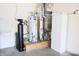 Utility room with water heater, furnace, and storage cabinet at 10949 Haig Point Dr, Fishers, IN 46037