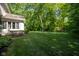Well-maintained lawn with privacy landscaping at 11350 Old Stone Dr, Indianapolis, IN 46236