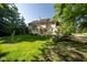 Landscaped backyard showcasing a spacious deck and lush lawn at 11350 Old Stone Dr, Indianapolis, IN 46236