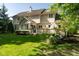 Landscaped backyard featuring deck and lush lawn at 11350 Old Stone Dr, Indianapolis, IN 46236
