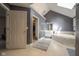 Bathroom featuring tiled floor, soaking tub, walk in closet, and neutral paint at 11350 Old Stone Dr, Indianapolis, IN 46236