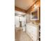 This bathroom has a shower-tub combo and a white vanity at 11350 Old Stone Dr, Indianapolis, IN 46236