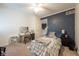 Bedroom featuring a ceiling fan, closet and blue accent wall and vanity at 11350 Old Stone Dr, Indianapolis, IN 46236