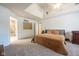 Spacious carpeted bedroom with vaulted ceilings, ceiling fan, and ensuite bathroom at 11350 Old Stone Dr, Indianapolis, IN 46236