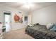 Bedroom with a ceiling fan and view into the hallway at 11350 Old Stone Dr, Indianapolis, IN 46236