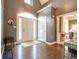 Welcoming foyer with hardwood floors, high ceilings, and a view into other living spaces at 11350 Old Stone Dr, Indianapolis, IN 46236