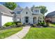 Beautiful home with a manicured front lawn and covered front porch at 11350 Old Stone Dr, Indianapolis, IN 46236