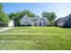 Charming two-story home with a spacious lawn, mature trees, and professional landscaping at 11350 Old Stone Dr, Indianapolis, IN 46236