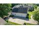 Aerial view of a three-car garage with an extra door to backyard and extended driveway at 11350 Old Stone Dr, Indianapolis, IN 46236