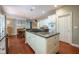 Spacious kitchen island with granite countertop and white cabinets offers ample storage and workspace at 11350 Old Stone Dr, Indianapolis, IN 46236