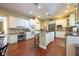 Well-appointed kitchen with white cabinetry, granite countertops, and stainless steel appliances, perfect for cooking at 11350 Old Stone Dr, Indianapolis, IN 46236