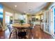 Open kitchen and dining area with hardwood floors and stainless appliances provide a great flow at 11350 Old Stone Dr, Indianapolis, IN 46236