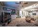 This living room features a large sectional and built in bookshelves at 11350 Old Stone Dr, Indianapolis, IN 46236