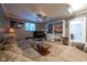 This living room features a large sectional and built in bookshelves at 11350 Old Stone Dr, Indianapolis, IN 46236