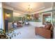 Elegant living room with plush seating, a chandelier, and large mirror, perfect for entertaining at 11350 Old Stone Dr, Indianapolis, IN 46236
