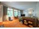 Cozy living room with large windows, neutral tones, plush carpet, and comfortable seating area at 11350 Old Stone Dr, Indianapolis, IN 46236