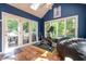 Bright sun room featuring skylights, tiled floors, and french doors at 11350 Old Stone Dr, Indianapolis, IN 46236
