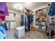 Spacious carpeted walk-in closet with built-in shelves and clothing rods at 11350 Old Stone Dr, Indianapolis, IN 46236