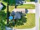 Aerial view of the home, with a fenced yard, above ground pool, driveway and street access at 12113 N Rooker Rd, Mooresville, IN 46158