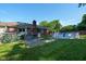 A spacious backyard with an above-ground pool, a deck, and lush green grass for outdoor enjoyment at 12113 N Rooker Rd, Mooresville, IN 46158