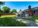 Brick home featuring a fenced backyard with a deck and a brick chimney at 12113 N Rooker Rd, Mooresville, IN 46158