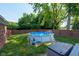 Above ground pool surrounded by grass and mature trees at 12113 N Rooker Rd, Mooresville, IN 46158