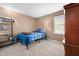 Cozy bedroom featuring neutral walls, carpet, window, and furnishings at 12113 N Rooker Rd, Mooresville, IN 46158