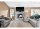 Comfortable living room featuring large window and gray fireplace at 12113 N Rooker Rd, Mooresville, IN 46158