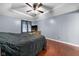 The main bedroom features hardwood floors, a ceiling fan, and natural light at 12113 N Rooker Rd, Mooresville, IN 46158