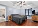 The main bedroom offers a ceiling fan, hardwood floors, natural light, and neutral paint at 12113 N Rooker Rd, Mooresville, IN 46158