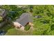 This aerial view reveals the home's well-maintained roof and the lush greenery surrounding the property at 1302 N Furman Ave, Indianapolis, IN 46214
