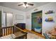 Bedroom boasts a crib, changing table, closet, and ample storage space at 1302 N Furman Ave, Indianapolis, IN 46214