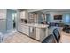 Kitchen with an island, stainless steel appliances, and modern design at 1302 N Furman Ave, Indianapolis, IN 46214