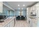 Kitchen features white cabinets and an eat-in dining space at 1302 N Furman Ave, Indianapolis, IN 46214