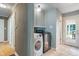 Laundry room with modern washer and dryer, and ceramic tile flooring at 1302 N Furman Ave, Indianapolis, IN 46214