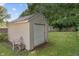 Backyard outbuilding providing ample storage space with a secure roll-up door at 1302 N Furman Ave, Indianapolis, IN 46214
