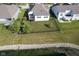 Aerial shot of property with lush green lawn near a body of water at 16235 Natures Way, Westfield, IN 46074