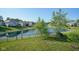 Tranquil backyard featuring a serene pond and well-maintained lawn at 16235 Natures Way, Westfield, IN 46074