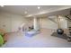 Versatile basement area with ample space for recreation, including a play area and workout equipment at 16235 Natures Way, Westfield, IN 46074