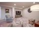 Finished basement area with plush seating, a TV, and stylish decor for a comfortable living space at 16235 Natures Way, Westfield, IN 46074