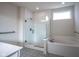 Modern bathroom featuring a soaking tub, glass shower, and stylish tile work at 16235 Natures Way, Westfield, IN 46074