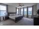 Calming bedroom with a large window allowing for lots of natural light, ceiling fan, and neutral decor at 16235 Natures Way, Westfield, IN 46074