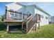 Wooden deck with stairs, perfect for outdoor gatherings and relaxation at 16235 Natures Way, Westfield, IN 46074
